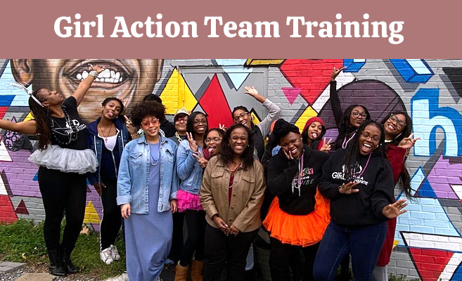 girl-action-team-training-2021 Girl Action Team Training, Coach and group of girls in front of a colorful mural