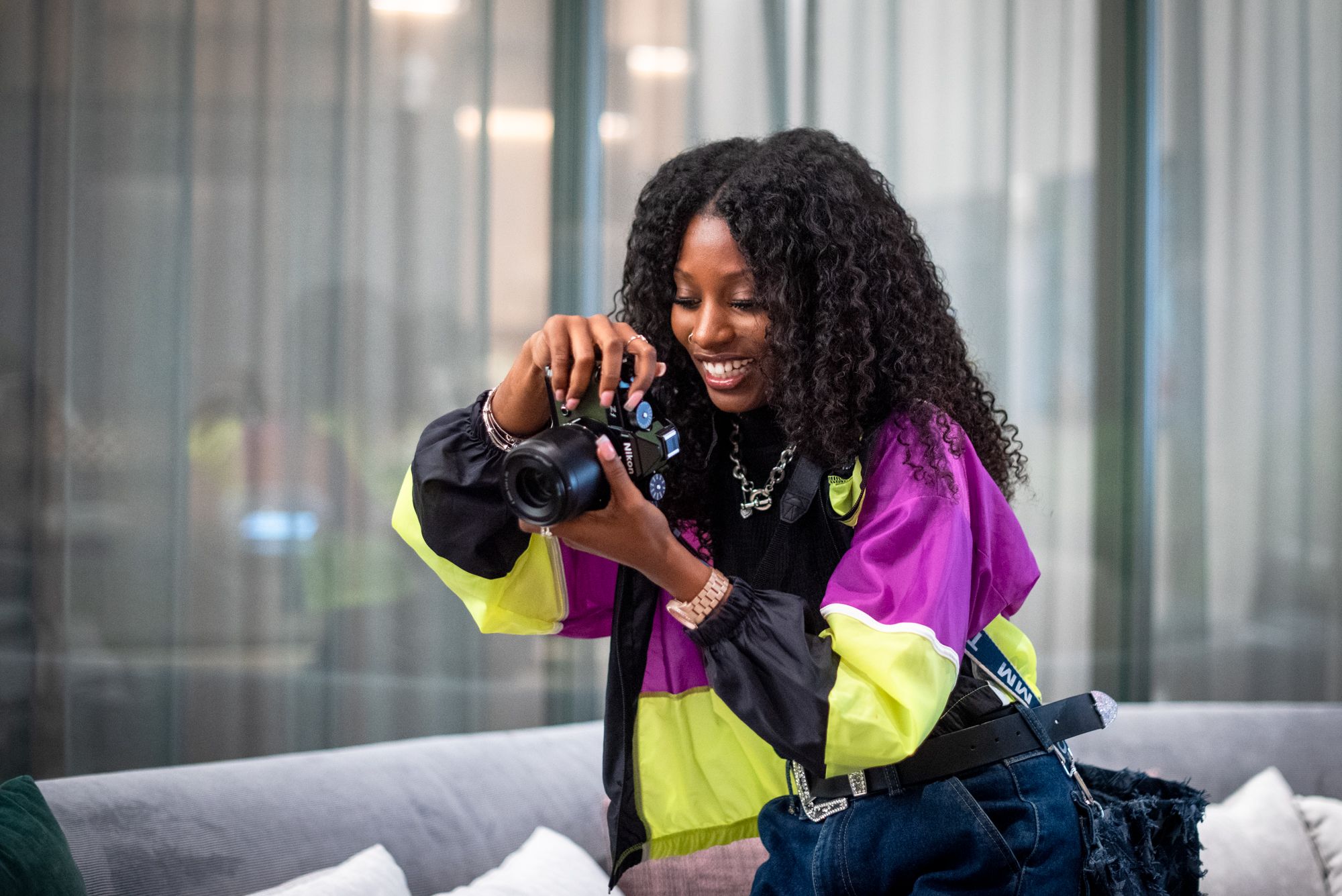 Girl holding camera and smiling